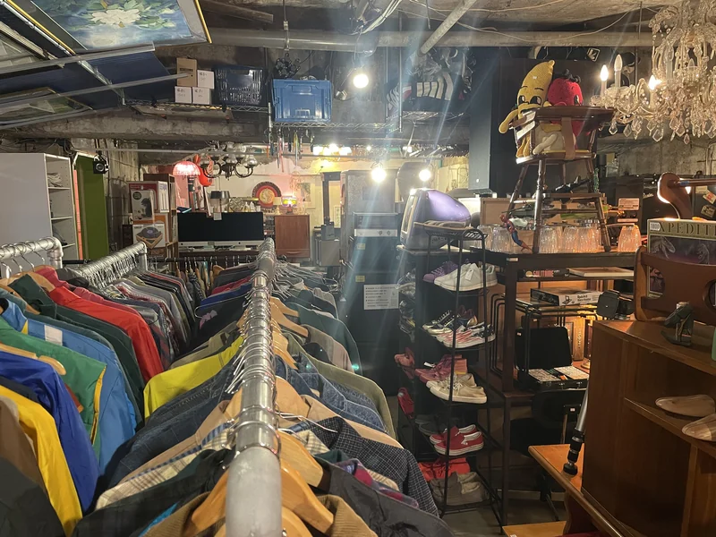 PONOPONO secondhand clothing area with racks of colorful garments