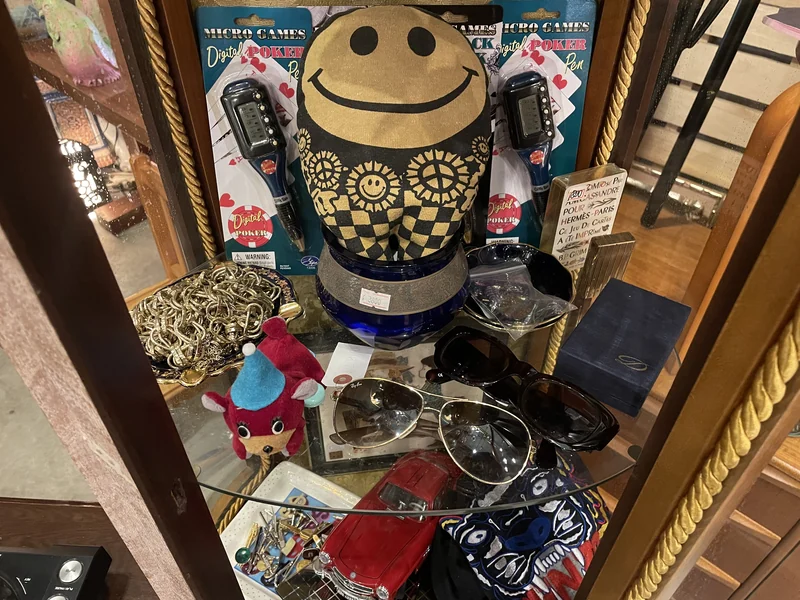 PONOPONO display case with collectible accessories and small objects